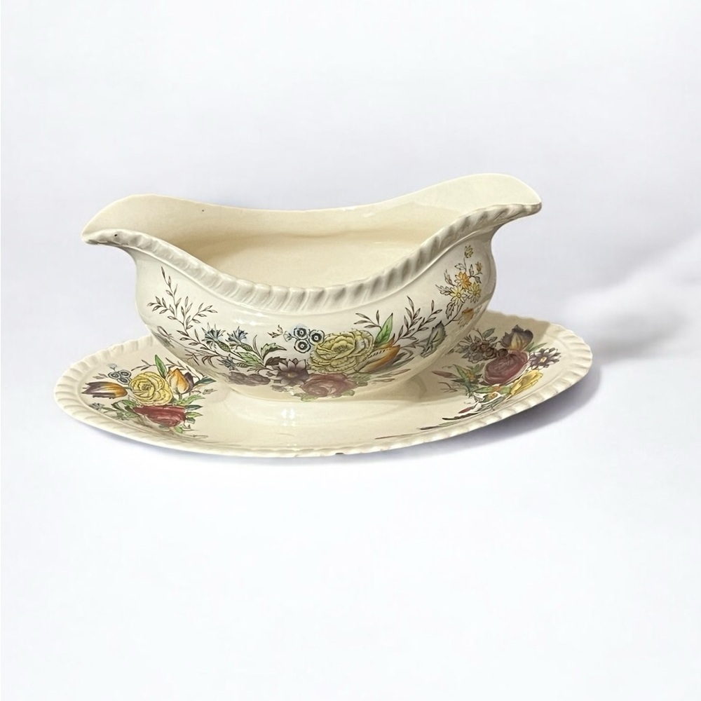 Johnson Bros Windsor Ware Garden Bouquet Gravy Boat with attached saucer.